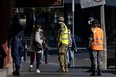 Australian Defence Force soldiers and members of the New South Wales Police Force patrol in the Bankstown CBD on August 07, 2021 in Sydney, Australia.