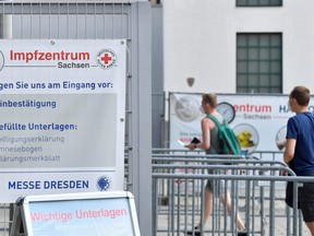 People arrive to receive a vaccine against COVID-19 at a centre at in Dresden, Germany, July 29, 2021.