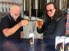 Alex Lifeson and Geddy Lee of Rush enjoying a glass of RUSH CANADIAN GOLDEN ALE, brewed in collaboration with Henderson Brewing Company, and in stores on August 30, in Ontario. (CNW Group/Henderson Brewing Company)