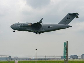 An RCAF C-17 Globemaster carrying evacuees from Afghanistan arrives at Toronto Pearson International Airport on Sunday, Aug. 8 2021