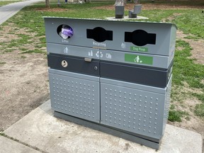 One of the City of Toronto bins to collect dog waste as part of a pilot project is seen at Victoria Memorial Square Park, at Wellington and Portland Sts., on May 15, 2021. A dog owner had just placed a bag of dog waste in the slot marked Litter.