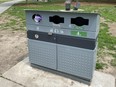 One of the City of Toronto bins to collect dog waste as part of a pilot project is seen at Victoria Memorial Square Park, at Wellington and Portland Sts., on May 15, 2021. A dog owner had just placed a bag of dog waste in the slot marked Litter.