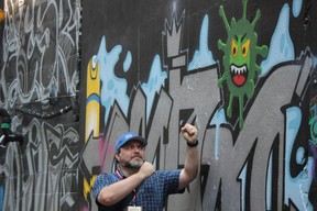 The pandemic has served as inspiration along Graffiti Alley. IAN SHANTZ/TORONTO SUN