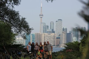 Our group is all smiles during a Toronto Bicycle Tours morning on the Toronto Islands. Included in the group is a family that recently moved to Toronto from Boston. IAN SHANTZ/TORONTO SUN