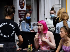 People enjoy outdoor dining as outdoor services in restaurants and bars recommences in Ireland as restrictions ease following the COVID-19 outbreak, in Galway, Ireland, June 7, 2021.