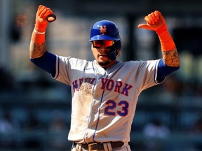 Javier Baez of the New York Mets reacts after hitting a double against the Los Angeles Dodgers in the 7th inning at Dodger Stadium in Los Angeles, Aug. 22, 2021.