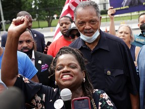 President and Founder of Transformative Justice Coalition Barbara Arnwine speaks as the Rev. Jesse Jackson listens during a demonstration at Lafayette Square Aug. 4, 2021 in Washington, D.C.