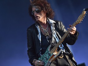 In this file photo taken June 22, 2018, guitarist Joe Perry performs with The Hollywood Vampires band as part of the Hellfest metal music festival in Clisson, France.