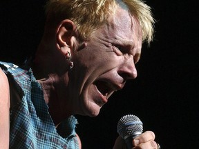 In this file photo, Johnny Rotten of the Sex Pistols performs in concert at Molson Amphitheatre in Toronto, Aug. 25, 2003.
