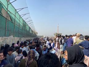 General view of the crowds of people near the airport in Kabul, Afghanistan, Monday, Aug. 23, 2021.