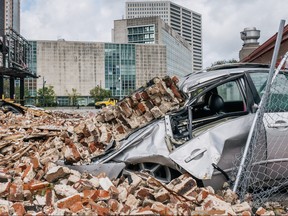 A car is seen under rubble after a building was destroyed by Hurricane Ida on Aug. 30, 2021 in New Orleans.