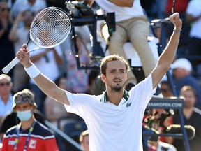Daniil Medvedev of Russia celebrates after defeating Reilly Opelka of the U.S. on Sunday to win the National Bank Open at Aviva Centre in Toronto.