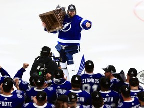 Andrei Vasilevskiy of the Tampa Bay Lightning is presented with the Conn Smythe Trophy after defeating the Montreal Canadiens 1-0 in Game 5 to win the 2021 NHL Stanley Cup Final at Amalie Arena on July 7, 2021 in Tampa, Fla.
