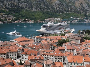 A view shows the Norwegian mega cruise ship 'Viking Venus,' with first passengers to Montenegro since the start of the coronavirus pandemic, docked in front of Old Town of Kotor, Montenegro July 17, 2021.