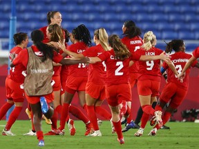 Canada celebrate winning the penalty shootout and the gold medal in women's soccer at  the International Stadium Yokohama August 6, 2021.