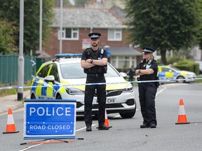 Police are seen at the scene of a shooting on August 13, 2021 in Plymouth, England.