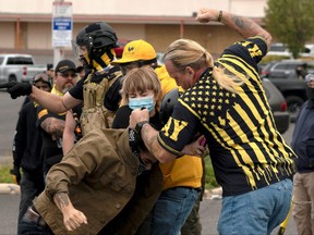 Members of the far-right Proud Boys clash with counter-protesters during rival rallies in Portland, Oregon, Aug. 22, 2021.
