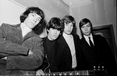 The Rolling Stones backstage Dec. 1, 1965 before their first Vancouver concert at the Agrodome. L-R Bill Wyman, Keith Richards, Mick Jagger, and Charlie Watts. Brian Jones is missing.