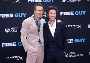 Ryan Reynolds poses with director Shawn Levy at the Free Guy premiere in New York.