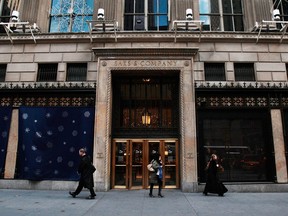 People walk outside of Saks Fifth Avenue on Nov. 18, 2008 in New York City.