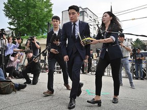 This file photo taken on August 28, 2019 shows former BIGBANG boyband member Seungri, real name Lee Seung-hyun, speaking to the media as he arrives for police questioning in Seoul.