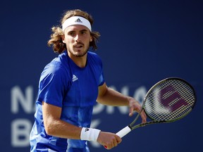 Stefanos Tsitsipas of Greece hits a shot against Reilly Opelka of the United States during a semifinal match on Day 6 of the National Bank Open at Aviva Centre on Aug. 14, 2021 in Toronto.