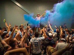 Philadelphia Union fans dance and sing on the concourse during a weather delay in the second half of a match against the D.C. United at Subaru Park in Chester, Pa., on July 17, 2021.