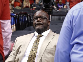 Shaq sits in the crowd during the second half of a Raptors game in Toronto on May 21, 2019.