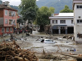 This handout picture released by Turkey's IHH humanitarian aid group on August 12, 2021 shows a car floating in water in Kastamonu, after flash floods swept across several Black Sea regions.