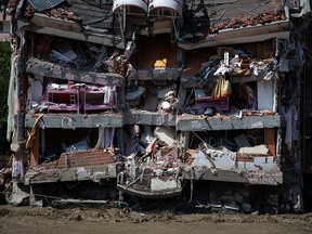 A partly collapsed building hit by flash floods that swept through towns in the Turkish Black Sea region in Bozkurt, a town in Kastamonu province, Turkey, August 13, 2021.