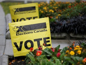 Vote signs sit near the Alan Emmott Centre on Election Day in Burnaby