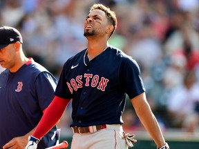 Xander Bogaerts of the Boston Red Sox reacts after striking out in the fourth inning during their game against the Cleveland Indians at Progressive Field on Aug. 28, 2021 in Cleveland, Ohio.