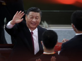 Chinese President Xi Jinping waves as he attends the art performance celebrating the 100th anniversary of the Founding of the Communist Party of China on June 28, 2021 in Beijing, China.