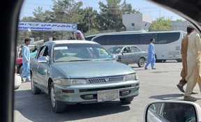 German buses transporting evacuees through checkpoints near Hamid Karzai International Airport in Kabul, Afghanistan on Tuesday, Aug. 24 2021