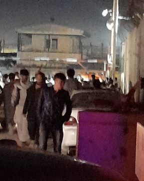 Afghans wait near Kabul airport to be rescued on Saturday, Aug. 21, 2021.