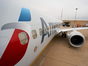 In this file photo taken on December 02, 2020 an exterior view of an American Airlines B737 MAX airplane is seen at Dallas-Forth Worth International Airport in Dallas, Texas.