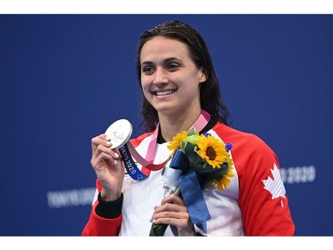 Silver medallist Canada's Kylie Masse poses with her medal after the final of the women's 200m backstroke swimming event during the Tokyo 2020 Olympic Games at the Tokyo Aquatics Centre in Tokyo on July 31, 2021. (Photo by Oli SCARFF / AFP)