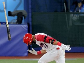 Dominican Republic's Jose Bautista shouts in jubilation on his walk-off RBI single during the ninth inning of the Tokyo 2020 Olympic Games baseball round 1 repechage game between Israel and Dominican Republic at Yokohama Baseball Stadium in Yokohama, Japan, on August 3, 2021.