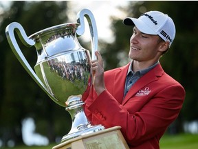 Danish golfer Rasmus Hojgaard poses with his trophy after winning the PGA European Tour golf tournament Omega European Masters on August 29, 2021 in Crans-Montana.