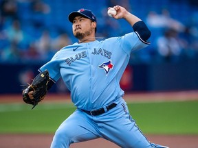 Toronto Blue Jays starting pitcher Hyun Jin Ryu (99) delivers against the Cleveland Indians during the first inning at Rogers Centre.