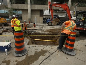 The City of Toronto, along with the TTC, doing streetcar track replacement on Queen St. W. on Wednesday, Aug. 11, 2021.