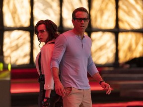 Jodie Comer as Molotov Girl and Ryan Reynolds as Guy in 20th Century Studios' FREE GUY.