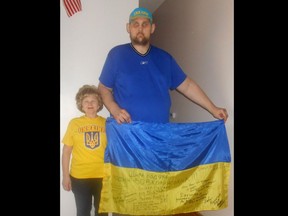 7-foot-8 Igor Vovkovinskiy, 38, standing next to his mother.