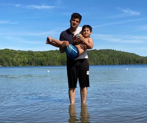 Samim Iqbal with his son Omar, who waits at home in Ottawa for his father to return safely from Kabul.