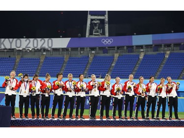 Tokyo 2020 Olympics - Softball - Women - Medal Ceremony - Yokohama Baseball Stadium - Yokohama, Japan - July 27, 2021. Canada players with their bronze medals on the podium. REUTERS/Jorge Silva