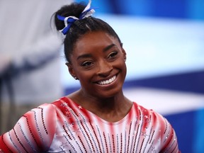 Tokyo 2020 Olympics - Gymnastics - Artistic - Women's Beam - Final - Ariake Gymnastics Centre, Tokyo, Japan - August 3, 2021.  Simone Biles of the United States reacts after performing on the balance beam.