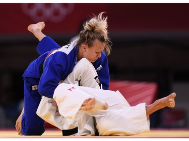 Tokyo 2020 Olympics - Judo - Women's 57kg - Bronze medal match - Nippon Budokan - Tokyo, Japan - July 26, 2021. Kaja Kajzer of Slovenia in action against Jessica Klimkait of Canada REUTERS/Annegret Hilse