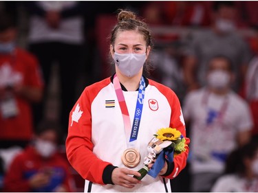 Tokyo 2020 Olympics - Judo - Women's 63kg - Medal Ceremony - Nippon Budokan - Tokyo, Japan - July 27, 2021. Bronze medallist Catherine Beauchemin-Pinard of Canada wearing a protective face mask poses during the medal ceremony REUTERS/Annegret Hilse