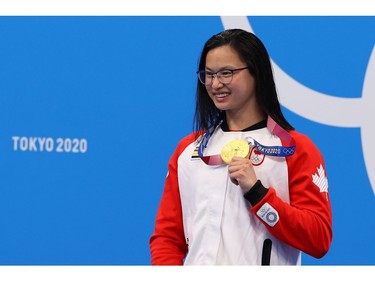 Tokyo 2020 Olympics - Swimming - Women's 100m Butterfly - Medal Ceremony - Tokyo Aquatics Centre - Tokyo, Japan - July 26, 2021. Gold medallist Margaret MacNeil of Canada poses. REUTERS/Marko Djurica