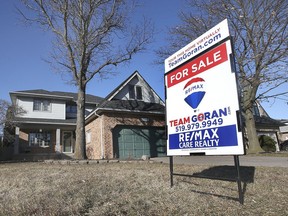 Local real estate prices are surging and available homes aren't on the market very long before being snapped up. Here, a For Sale is shown in front of a home in the 13000 block of St Gregory's Road in Tecumseh on Monday, March 1, 2021.